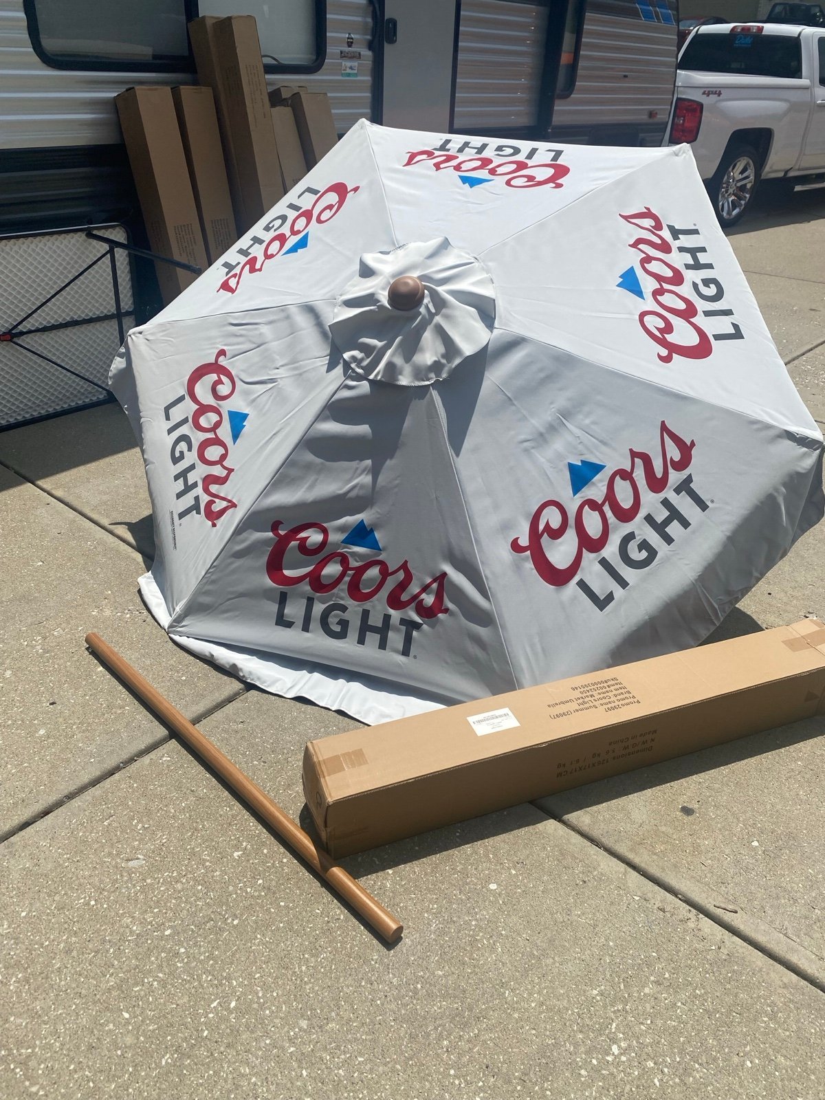 New in the box Coors light patio umbrella