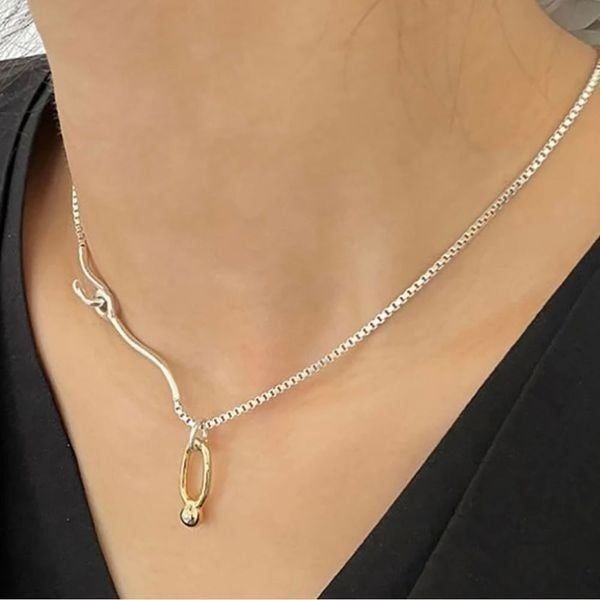 The Asymmetry Two Tone Abstract necklace in 925 silver.