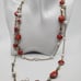 Glistening orange retro pearl necklace