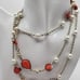 Glistening orange retro pearl necklace