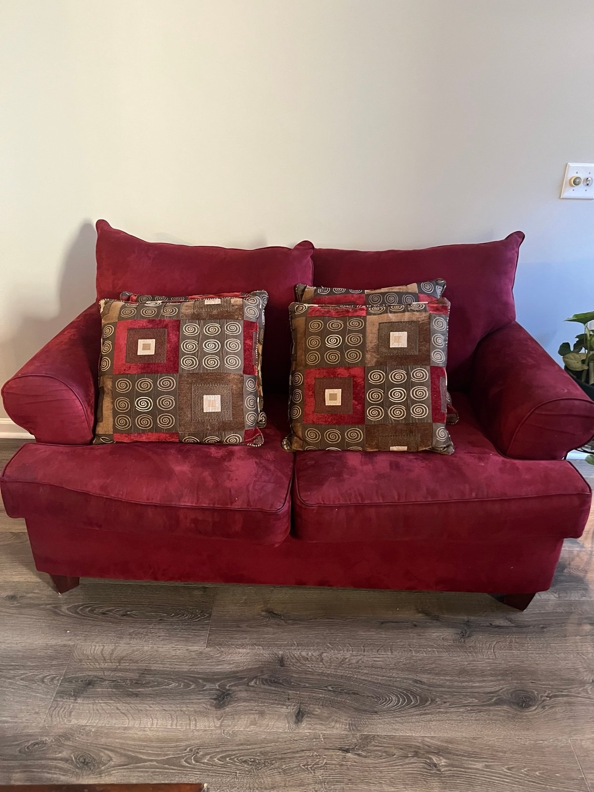 Loveseat and chair with pillows