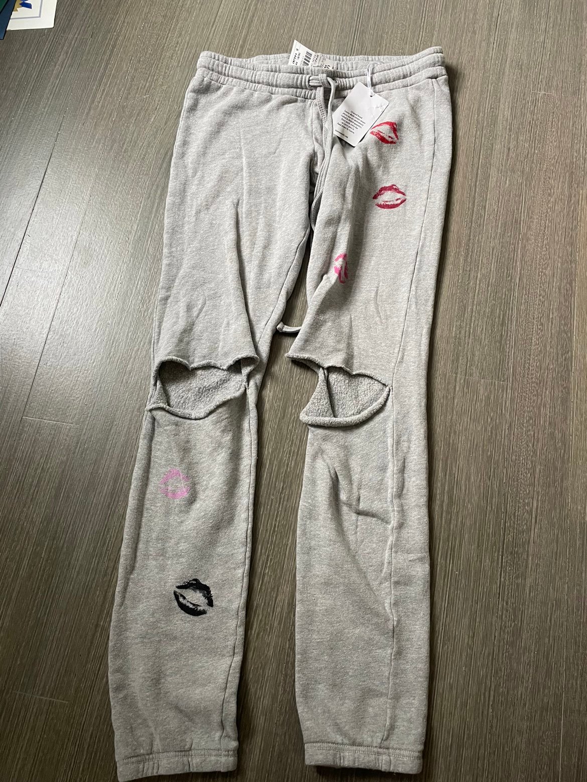 Grey sweatpants with kiss marks