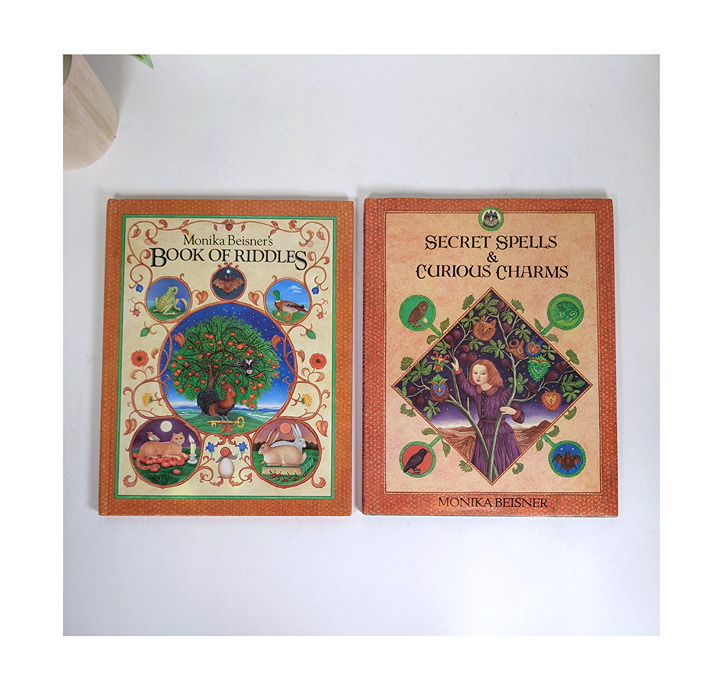 2 Monica Beisner's - Book of Riddles &Secret Spells and Curious Charms Hardcover