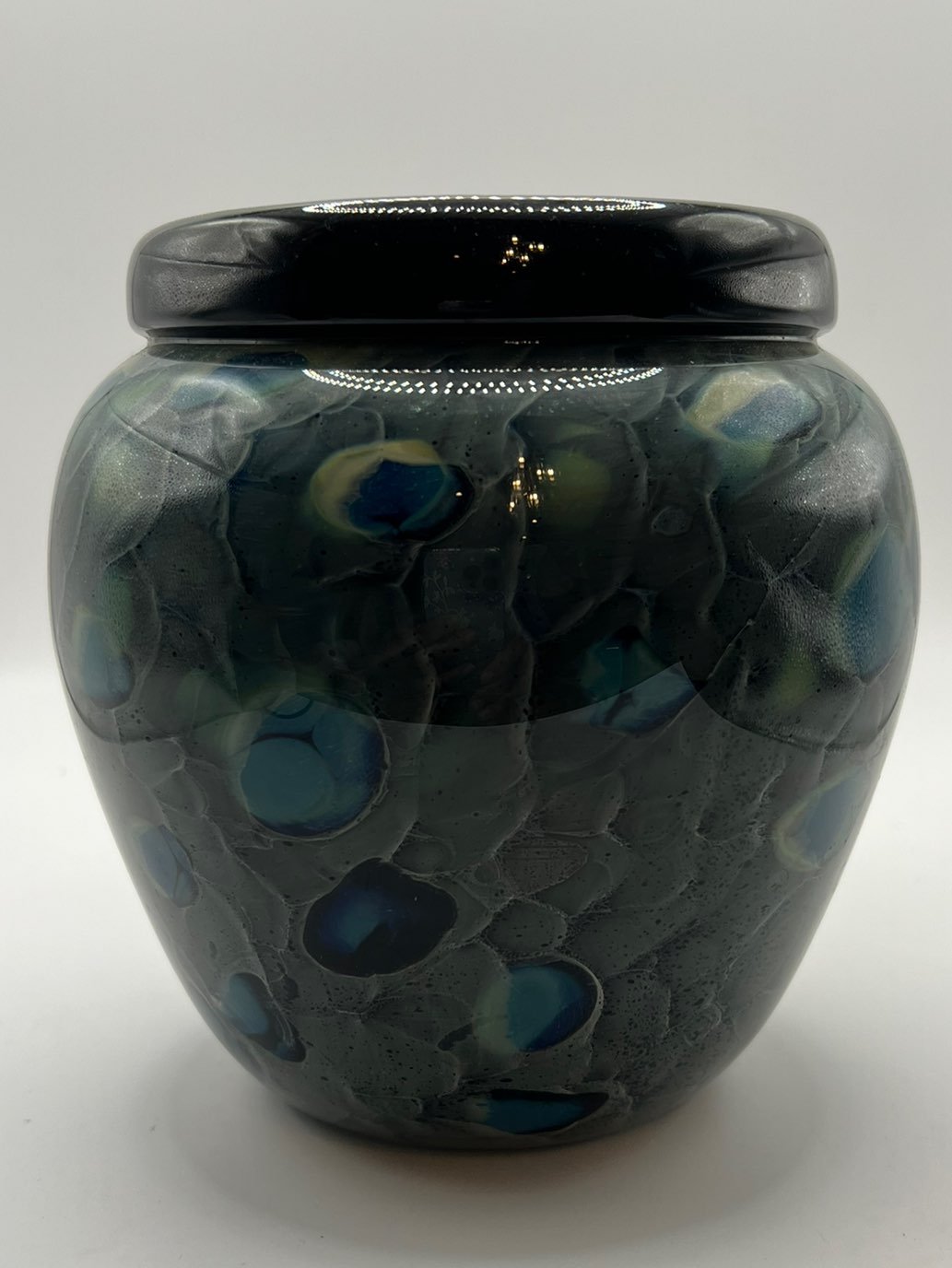 Hand blown swirl glass planter.