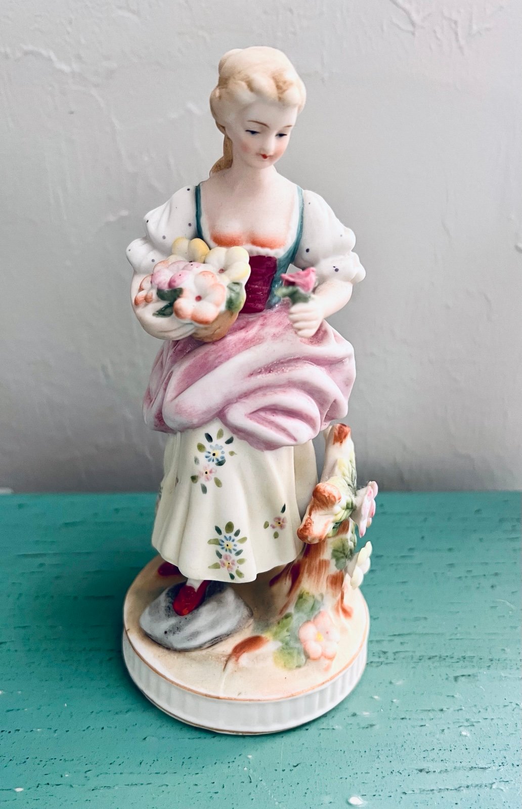 Vintage Candrea porcelain figurine titled Lady Gathering Flowers hand made