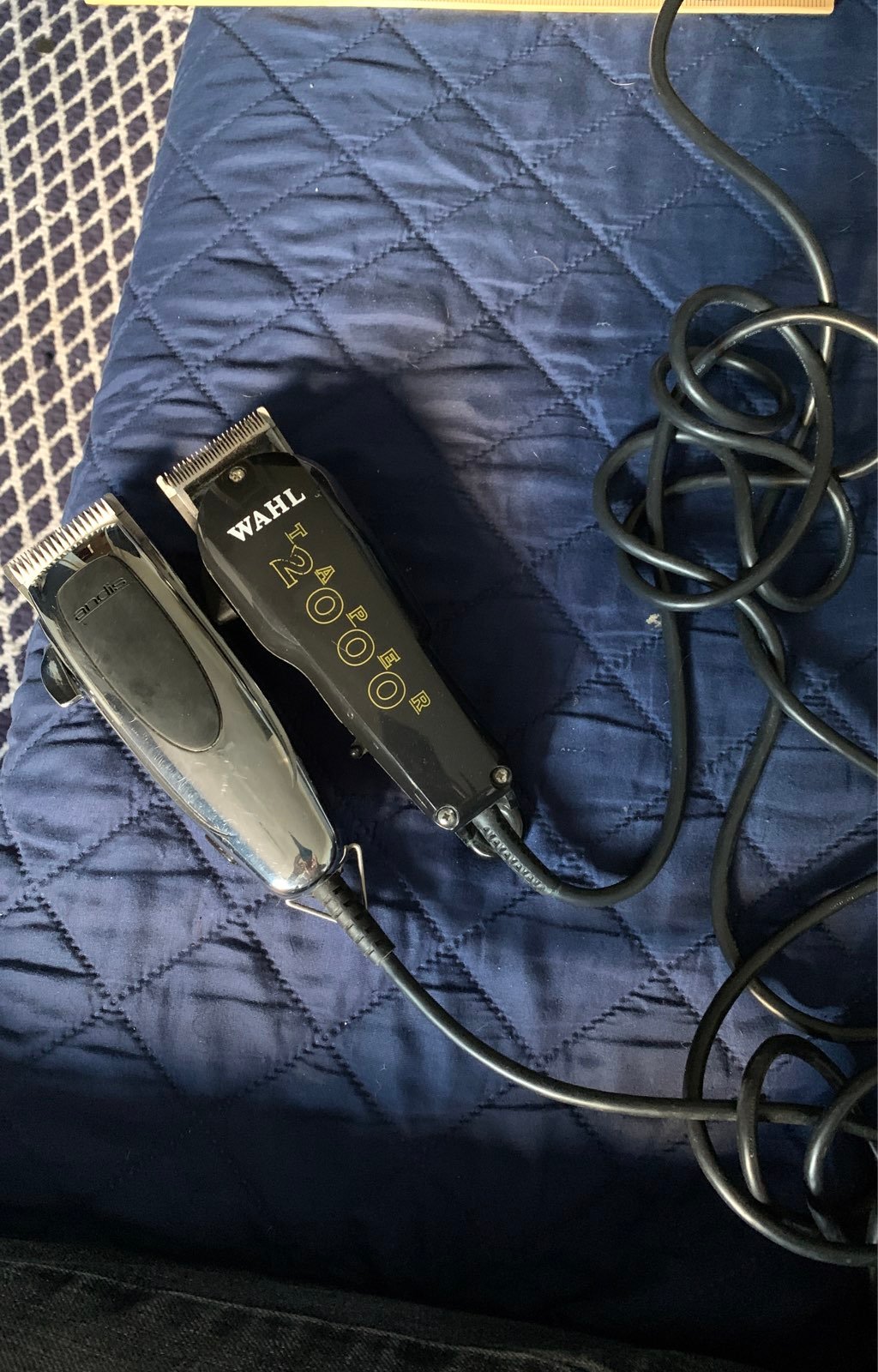 Two hair clippers one andis andthe other wahl