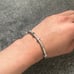 Silver bangle bracelet with rhinestones and screw design. Size 18cm clip on lock