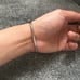 Silver bangle bracelet with rhinestones and screw design. Size 18cm clip on lock