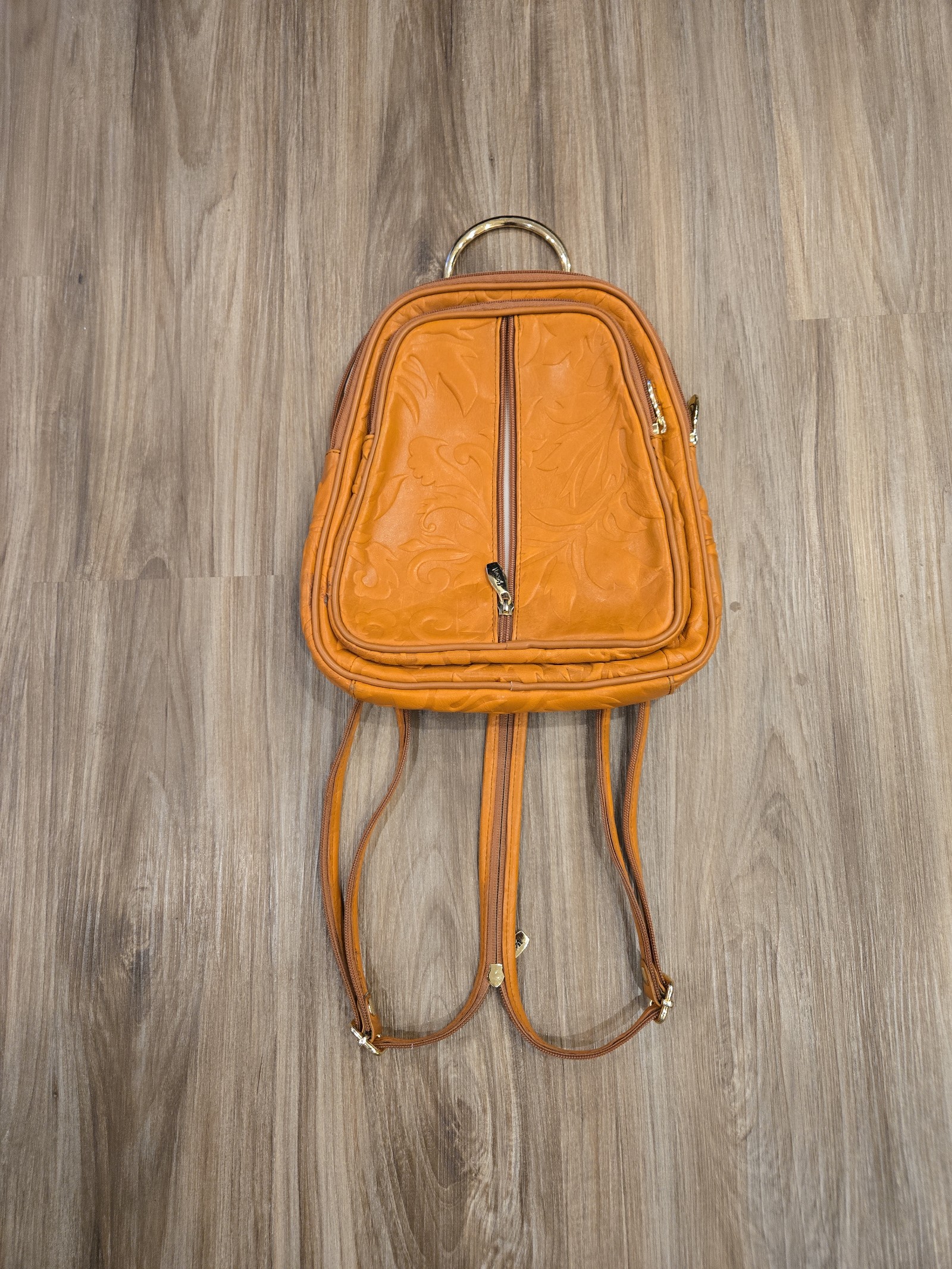 Valentina tooled leather backpack with flower design.