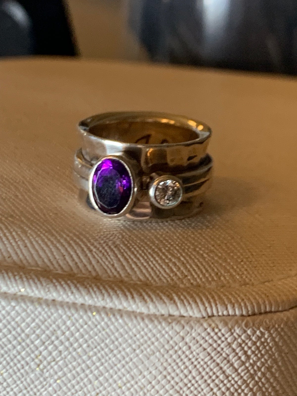 Rotatable ring with oval Amethyst and round white topaz