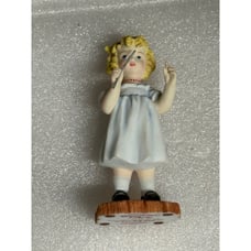 Raggedy ann figurine freindshipis the rhythm of life Marcella as the conductor