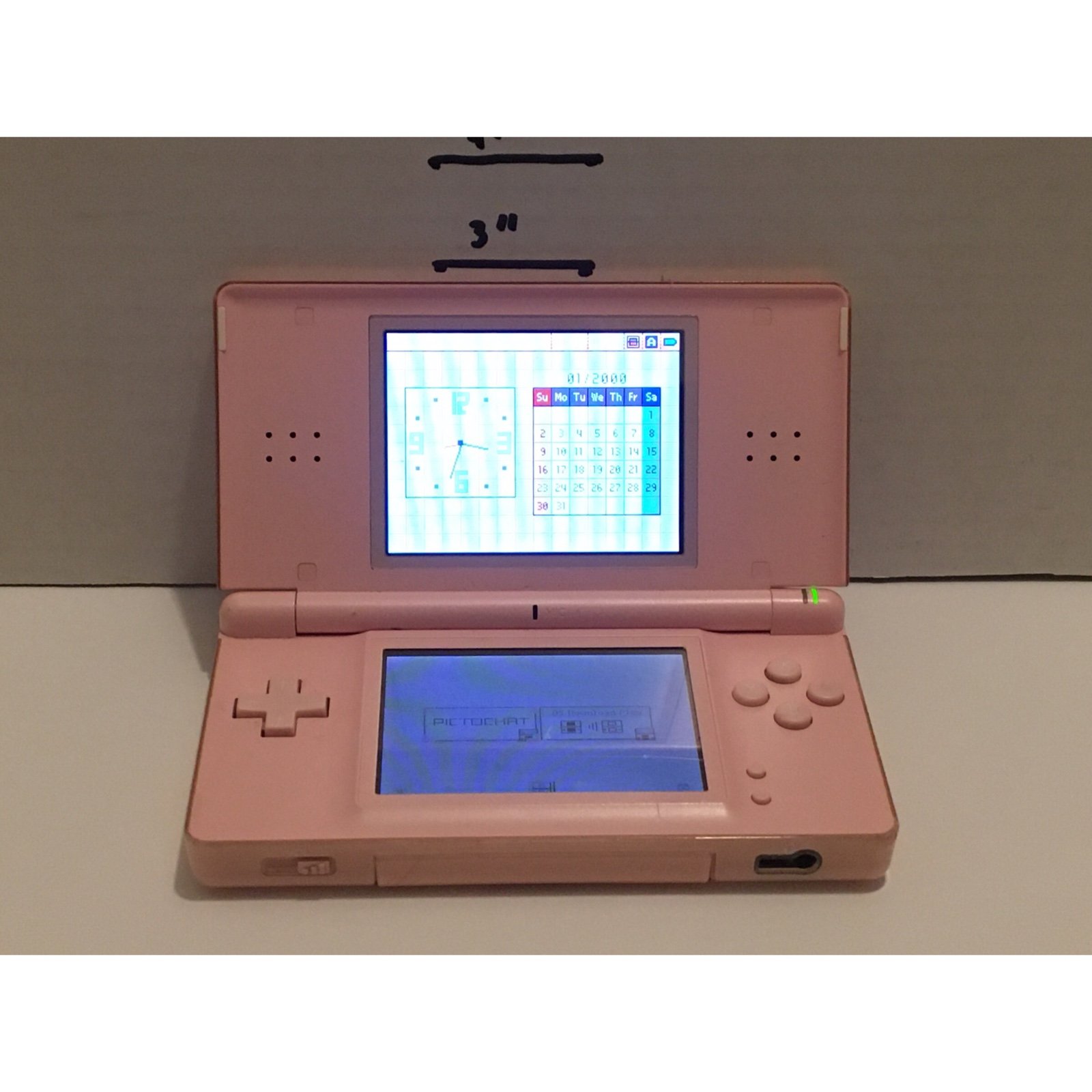 Pink Nintendo DS lite handheld video game system with charger