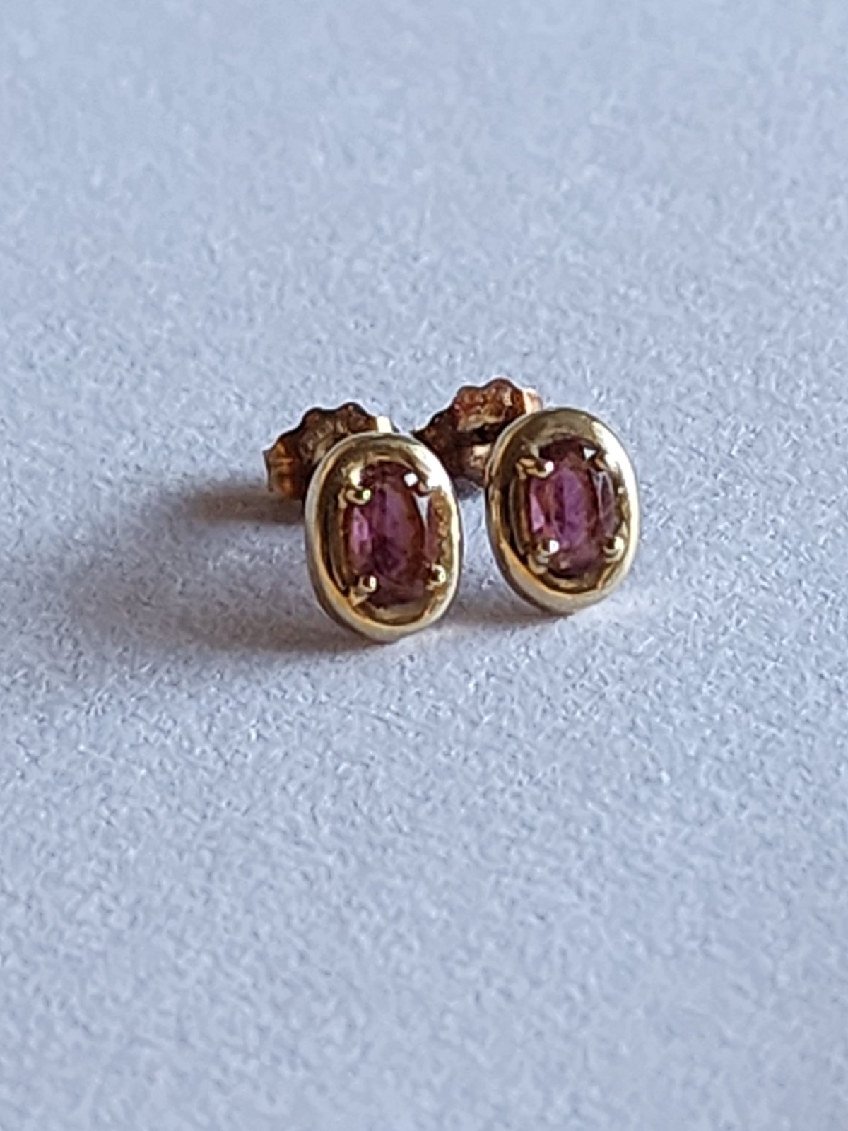 14k gold ruby earrings.