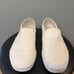 White Slip-On Vans • Women 7.5