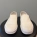 White Slip-On Vans • Women 7.5