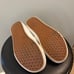 White Slip-On Vans • Women 7.5