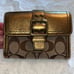 Coach Signature Buckle Monogrammed Canvas & Metallic Gold Leather Trifold Wallet