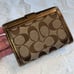 Coach Signature Buckle Monogrammed Canvas & Metallic Gold Leather Trifold Wallet