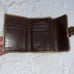 Coach Signature Buckle Monogrammed Canvas & Metallic Gold Leather Trifold Wallet