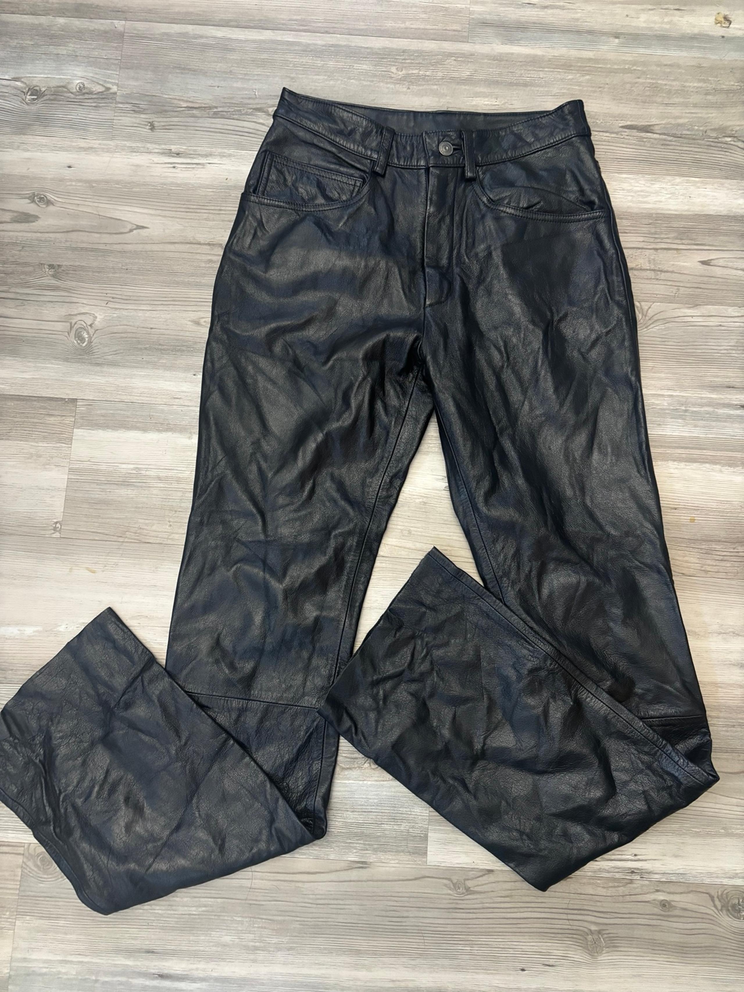 Wilson’s Maxima Black vintage leather pants waist is 14, length is 33, raw hem #