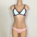 New. Pilyq blush/pink, brown, mint bikini. D-cup top/ S-bottom. Normally 168