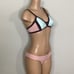 New. Pilyq blush/pink, brown, mint bikini. D-cup top/ S-bottom. Normally 168