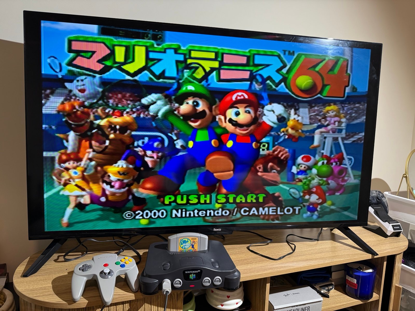 Classic grey Nintendo 64 with controller and cables