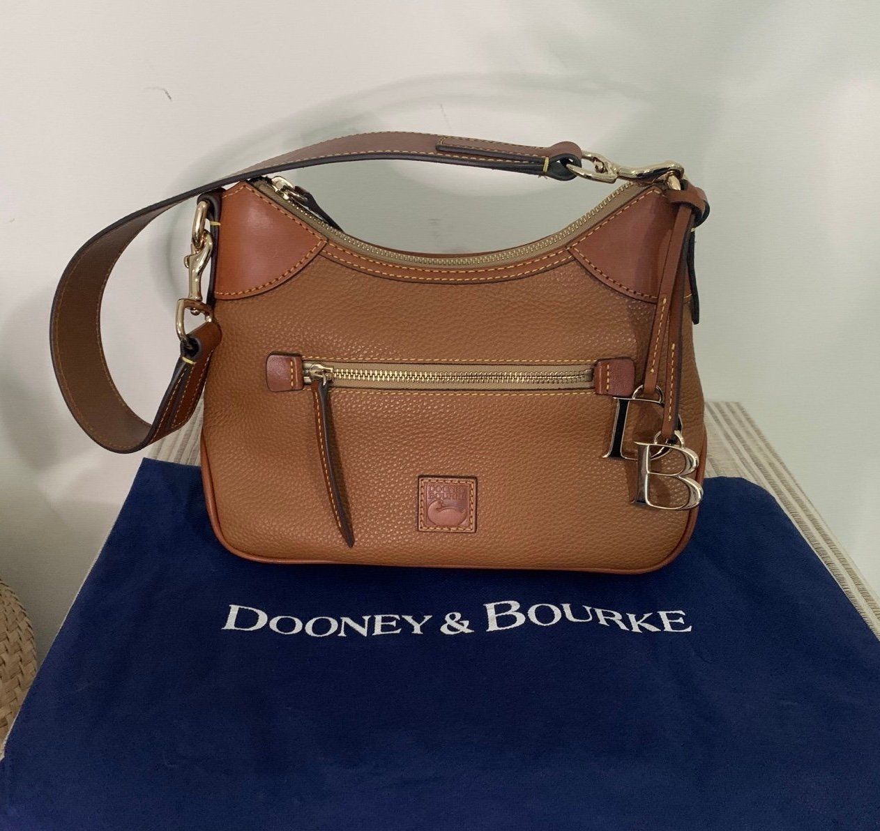 Dooney & Bourke Tan Small Pebbled Leather Hobo with DB charm, sticker & dust bag