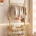 A Single-Rod Clothes Rack with Four Wheels, Designed for Hanging Garments, Porta
