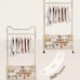 A Single-Rod Clothes Rack with Four Wheels, Designed for Hanging Garments, Porta