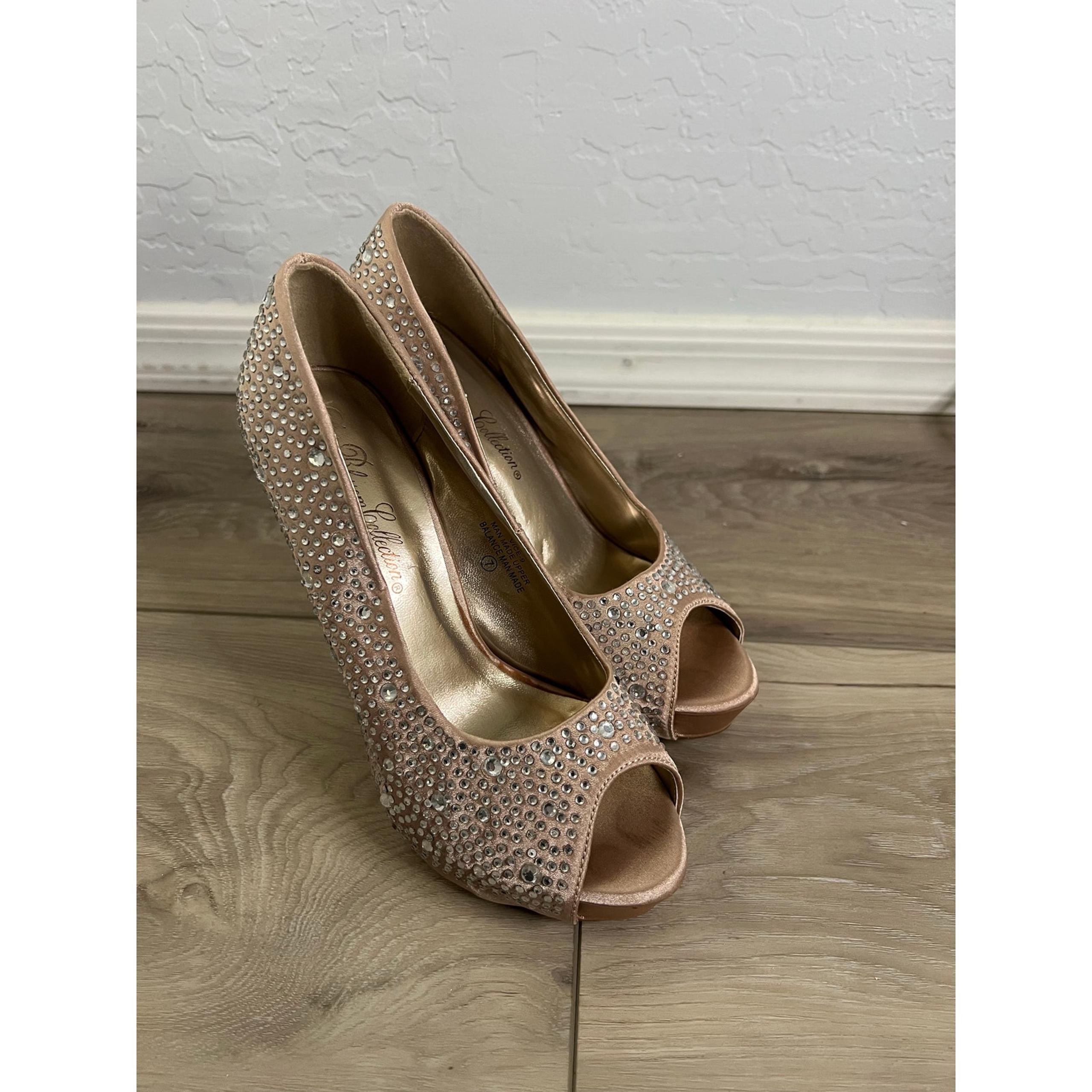 Women’s rhinestone peep toe pumps