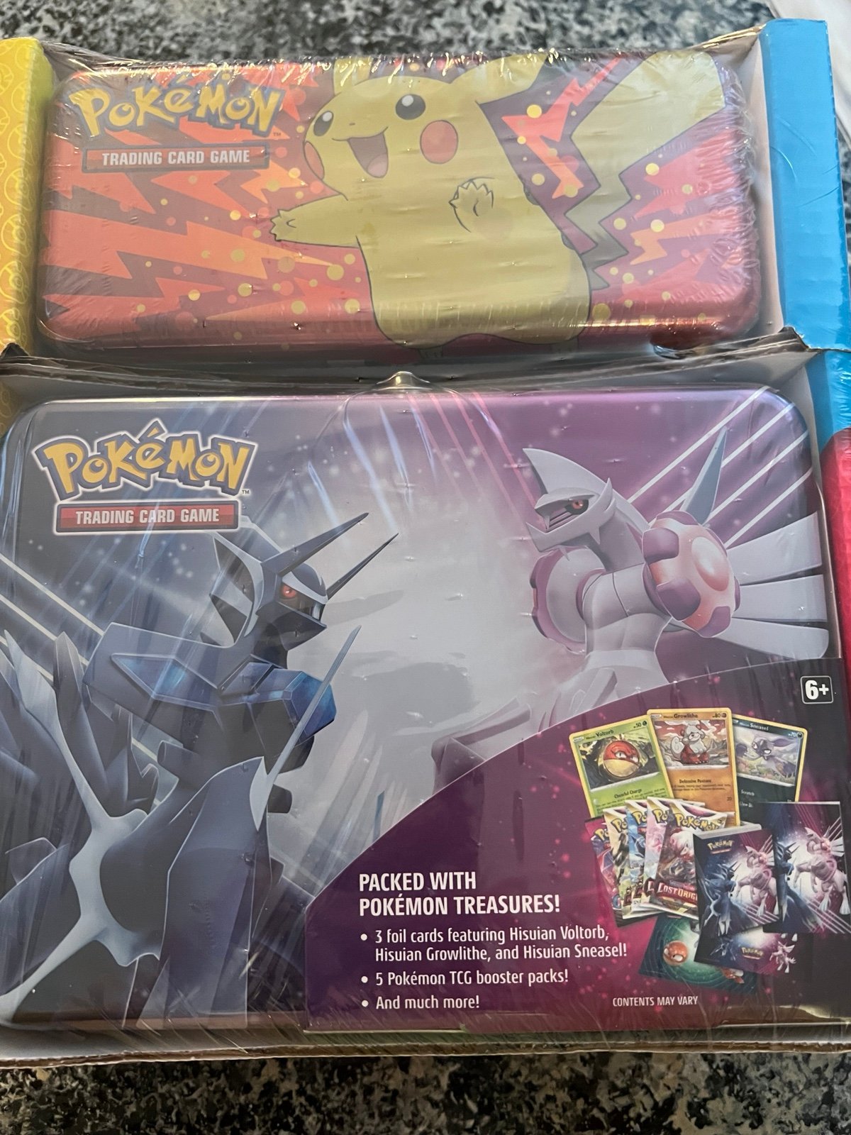 Pokemon card set with tins