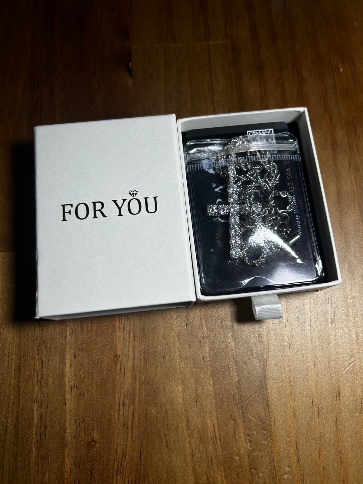 Moissanite cross with silver rope chain