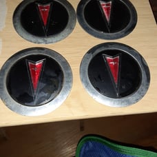 Pontiac 6000 wire hubcap emblems