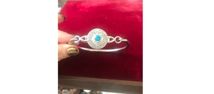 Sterling silver bangle bracelet with white and blue stones