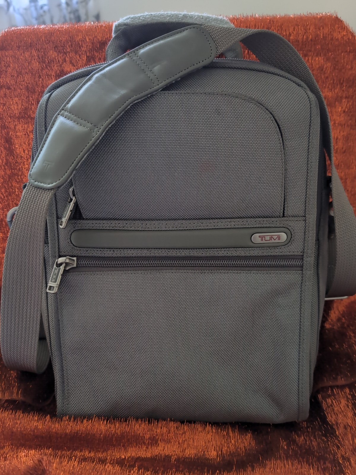 Tumi travel crossbody bag. Very good condition and clean.