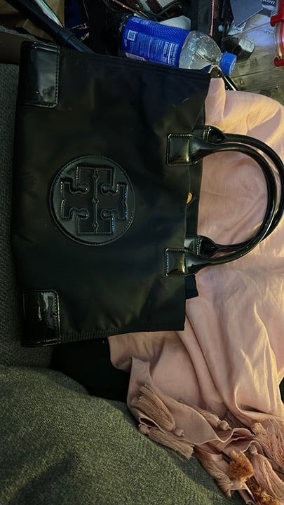 Tory Burch nylon tote in black features a sleek patent-leather like finish
