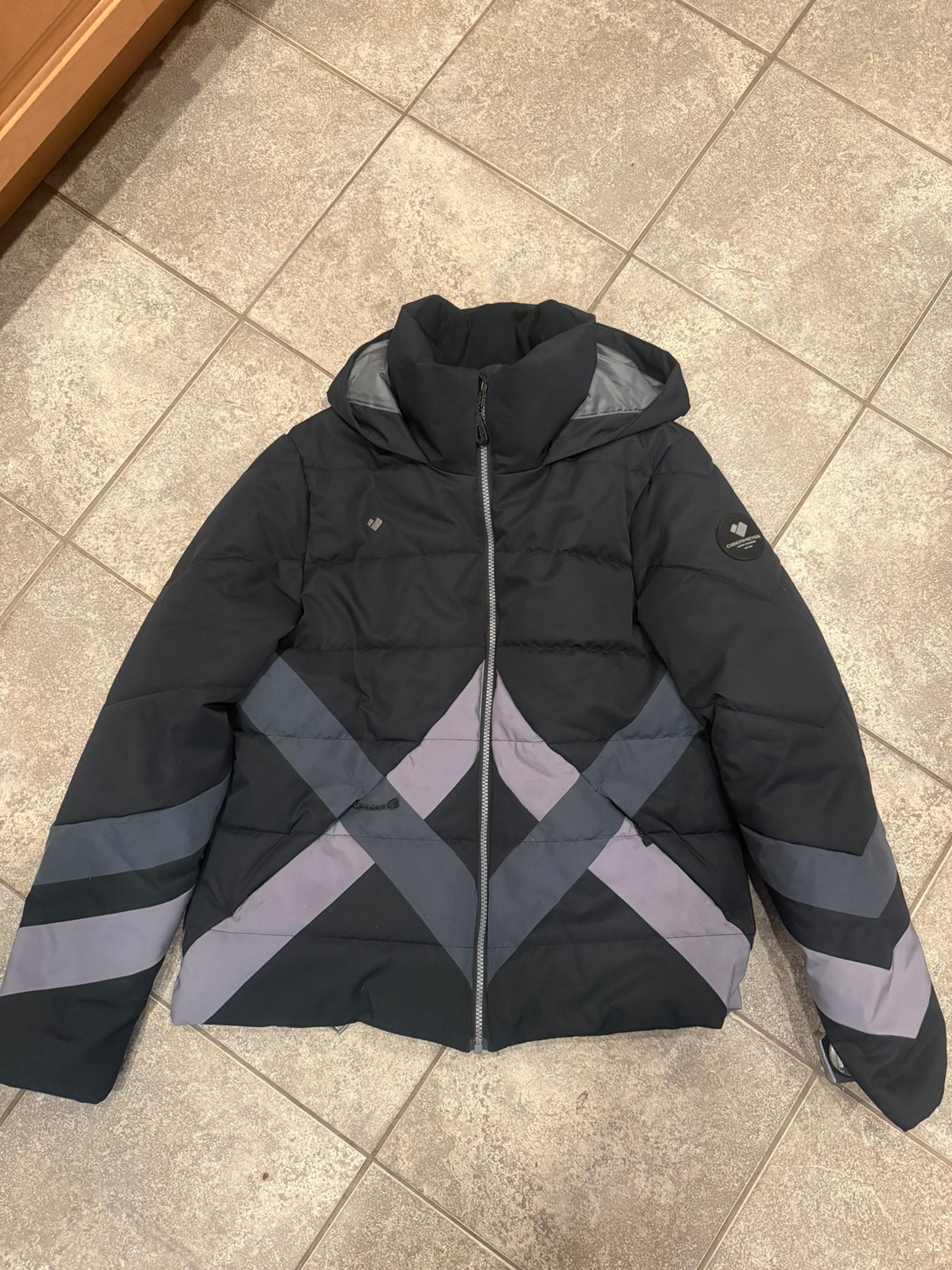 Woman’s Obermeyer winter coat size 10 black and grey