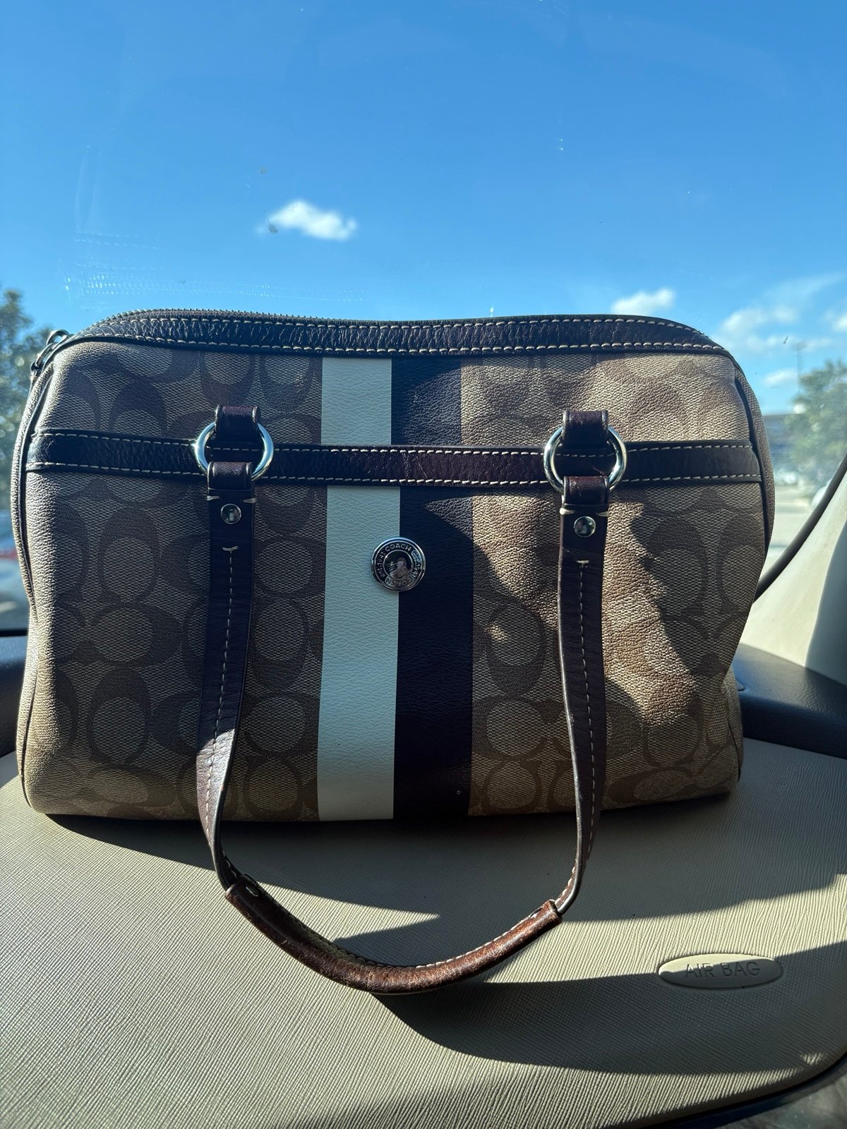 brown coach monogram handbag