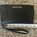 Black Michael Kors wristlet/phone holder