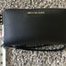 Black Michael Kors wristlet/phone holder