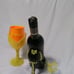 Wine bottle holder with glass and a shot of