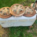 Researched Three old peugeot hubcaps