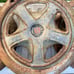 Researched Three old peugeot hubcaps