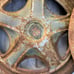Researched Three old peugeot hubcaps