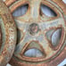 Researched Three old peugeot hubcaps