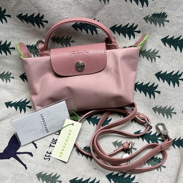 Light pink handbag with crossbody strap