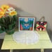 Table, pictures and flowers.