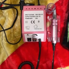 nail drill with practice hand and finger