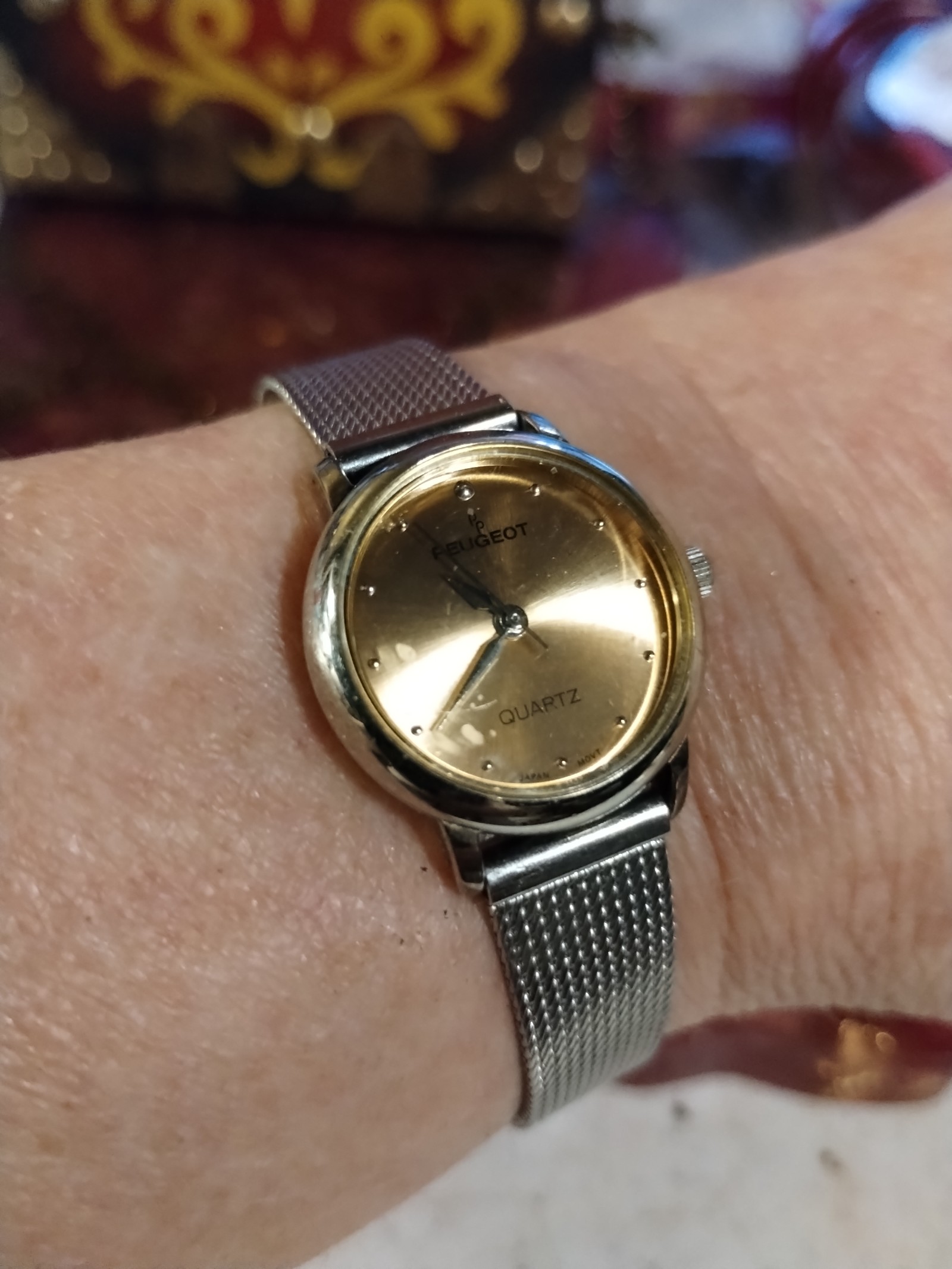 Beautiful vintage Peugeot silver banded and pink faced watch